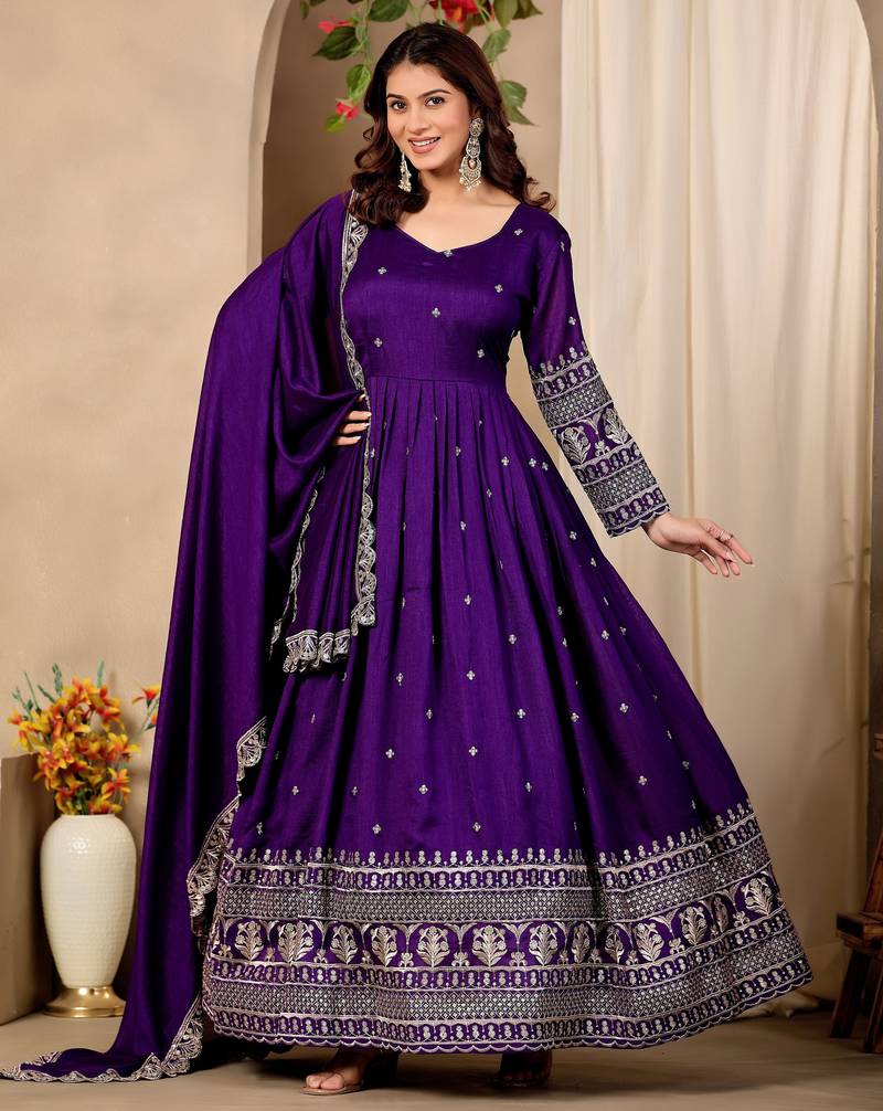 Purple color fancy ceremonial art silk fabric gown with dupatta