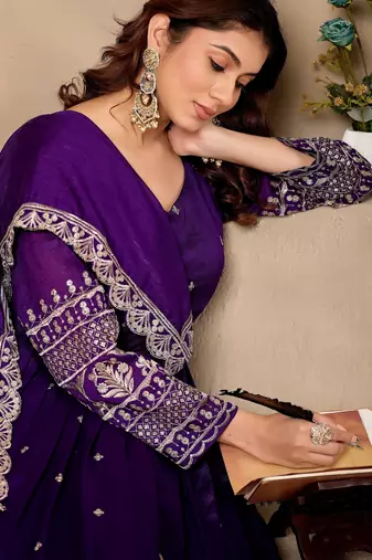 Purple color fancy ceremonial art silk fabric gown with dupatta