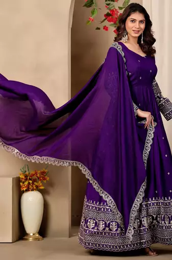 Purple color fancy ceremonial art silk fabric gown with dupatta