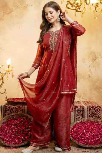 Rust color smart crunchy fabric designer graceful partywear suit for trendy girlie looks