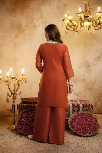 Orange color smart crunchy fabric designer graceful partywear suit for trendy girlie looks