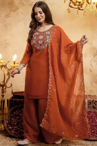 Orange color smart crunchy fabric designer graceful partywear suit for trendy girlie looks