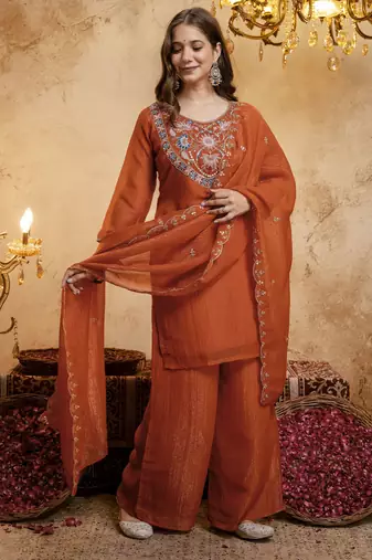 Orange color smart crunchy fabric designer graceful partywear suit for trendy girlie looks