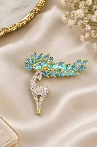 Elegant swan bird brooch with blue crystal leaf design & rhinestone detailing