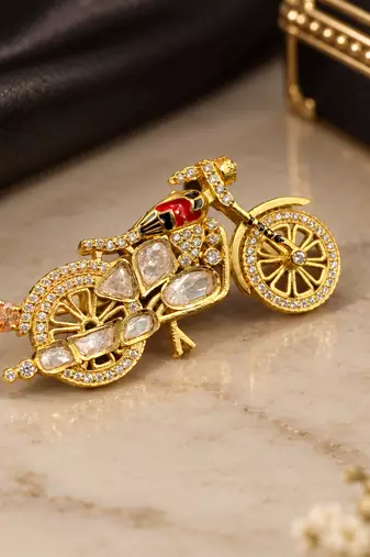 Elegant bicycle brooch with crystal embellishments & red enamel detailing