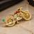 Elegant bicycle brooch with green crystal, clear stones & red enamel detailing