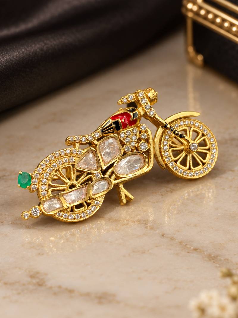 Elegant bicycle brooch with green crystal, clear stones & red enamel detailing
