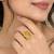 Elegant golden yellow gemstone statement ring with clear stone border