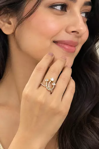 Elegant gold tone crown design statement ring with clear stone accents