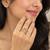Elegant gold tone crown design statement ring with clear stone accents