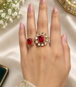 Elegant gold tone red gemstone floral statement ring with clear stone halo