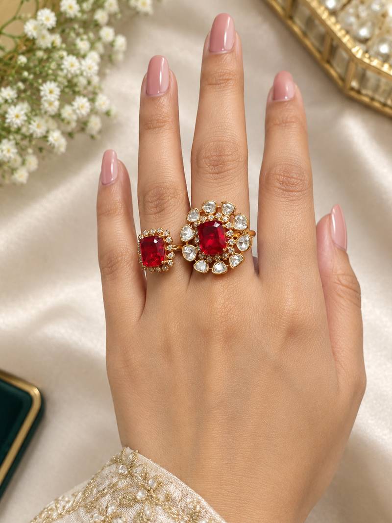 Elegant gold tone red gemstone floral statement ring with clear stone halo