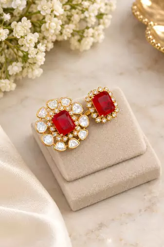 Elegant gold tone red gemstone floral statement ring with clear stone halo