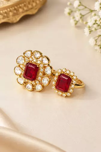 Elegant gold tone red gemstone floral statement ring with clear stone halo