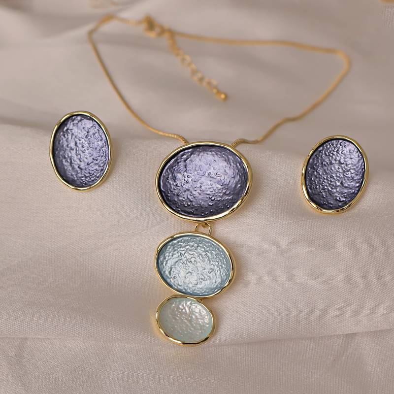 Blue pendant necklace set with matching earrings for women