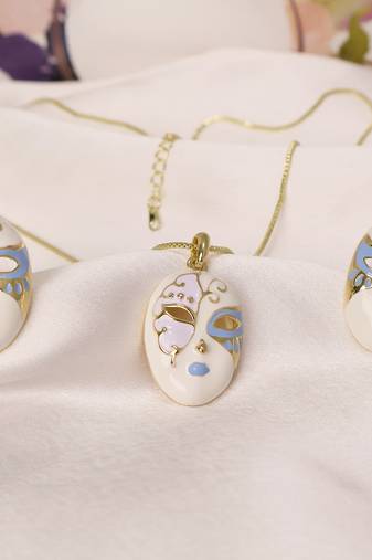 White & blue enamel venetian mask pendant necklace set with matching earrings