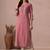 Women straight fit cotton kurta with cordwork floral embroidery on yoke sleeves.