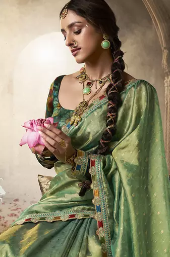 pista zari tissue lace work festive wear saree