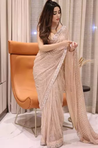 Peach party wear soft georgette sequin saree with plain blouse