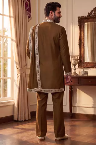 yellow kurta set with silver mirror work and an attached stole