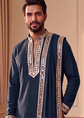 Blue lachka kurta set with silver mirror work and an attached stole. 1