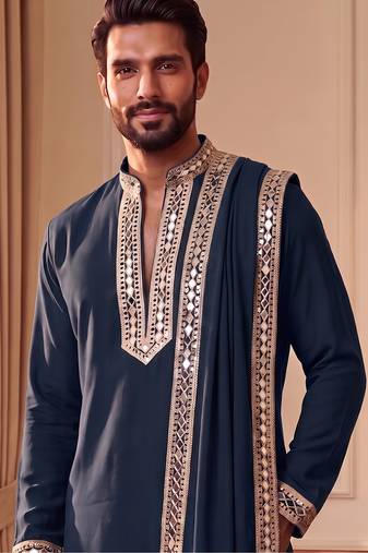 Blue lachka kurta set with silver mirror work and an attached stole.