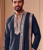 Blue lachka kurta set with silver mirror work and an attached stole.