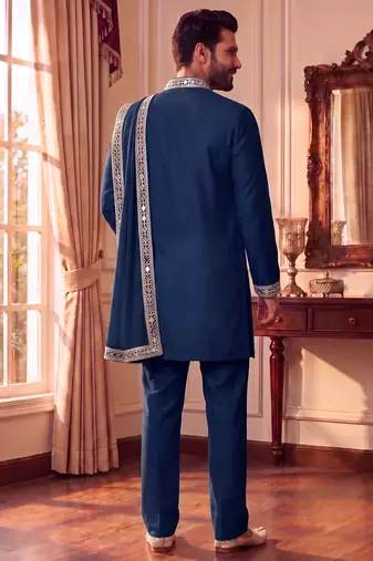 Blue lachka kurta set with silver mirror work and an attached stole.