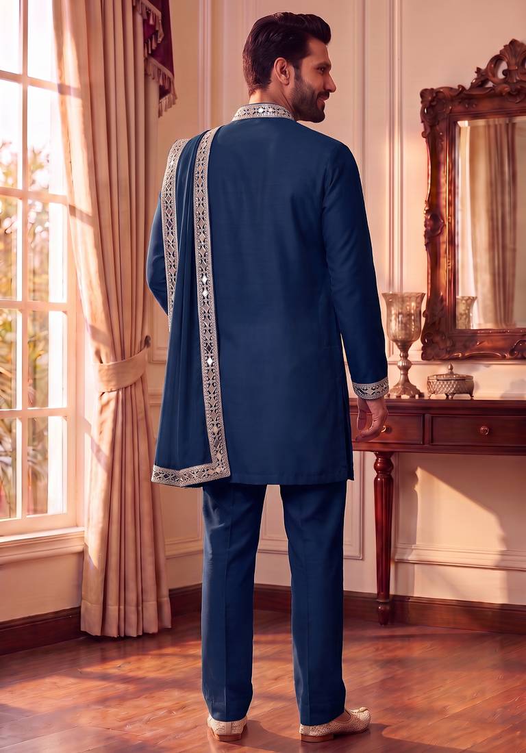 Blue lachka kurta set with silver mirror work and an attached stole.