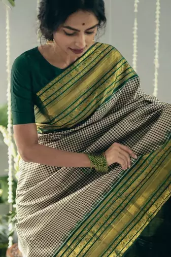 Beige green silk blend jacuard work festival saree with unstitched blouse piece