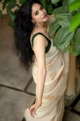 Cream green silk blend jacuard work festival saree with unstitched blouse piece