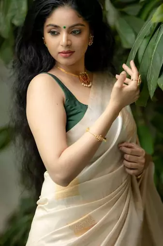 Cream green silk blend jacuard work festival saree with unstitched blouse piece