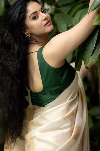Cream green silk blend jacuard work festival saree with unstitched blouse piece