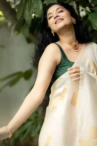 Cream green silk blend jacuard work festival saree with unstitched blouse piece