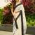 White black silk blend jacuard work festival saree with unstitched blouse piece