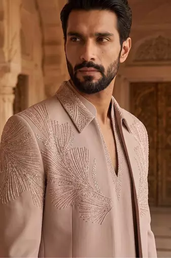 Heavy lachaka 3-piece short jodhpuri featuring intricate handwork, cotton lining, and a luxurious designer finish.