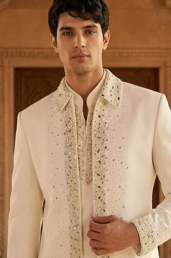 Heavy lachaka 3-piece short jodhpuri featuring intricate handwork, cotton lining, and a luxurious designer finish.