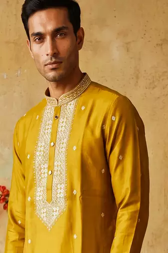 Yellow roman silk embroidered kurta with cream pajama     elegant party wear look