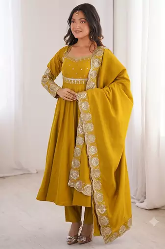Yellow heavy embroidered flared anarkali suit with pant and dupatta set