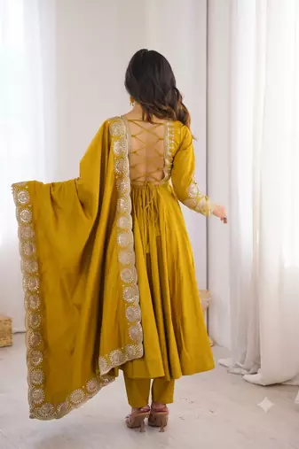 Yellow heavy embroidered flared anarkali suit with pant and dupatta set