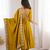 Yellow heavy embroidered flared anarkali suit with pant and dupatta set