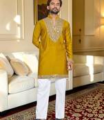 Yellow solid silk men kurta with handwork embroidered neck