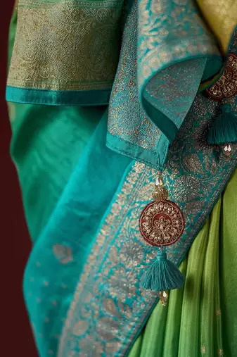 shaded olive & sky blue dola silk blend with zari weaving party wear saree