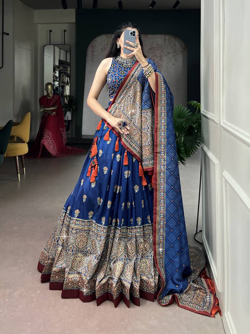 Women's Tussar Silk Ajrakh Print Lehenga Choli with Mirror Work and Dupatta for Navratri Garba Wear