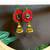 red fabric with jhumkas