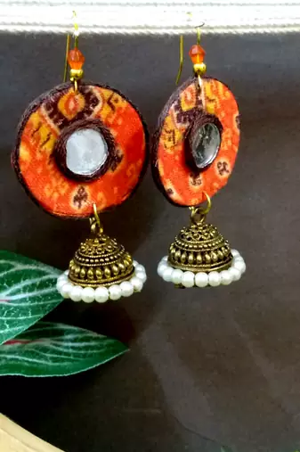 Orange fabric with jhumkas
