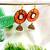 Orange fabric with jhumkas