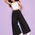 Black cotton pleated wide-leg trousers for women