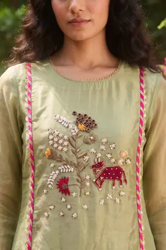 Elegant pista green tissue kurta pant set featuring palm motifs with delicate sequin and bead work, finished.
