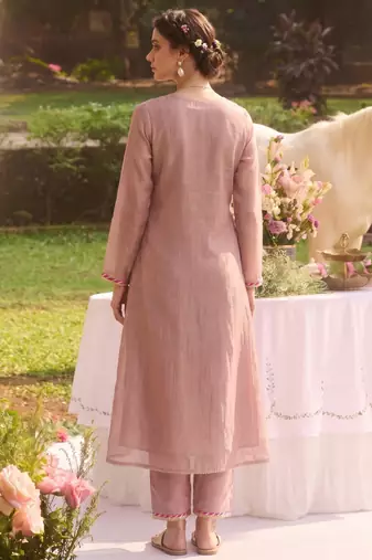 Elegant dusty pink tissue kurta pant set featuring intricate palm motifs with sequin and bead work, enhanced.